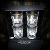 A Beautiful set of four whisky glasses engraved with Deer, fisherman and hunter.